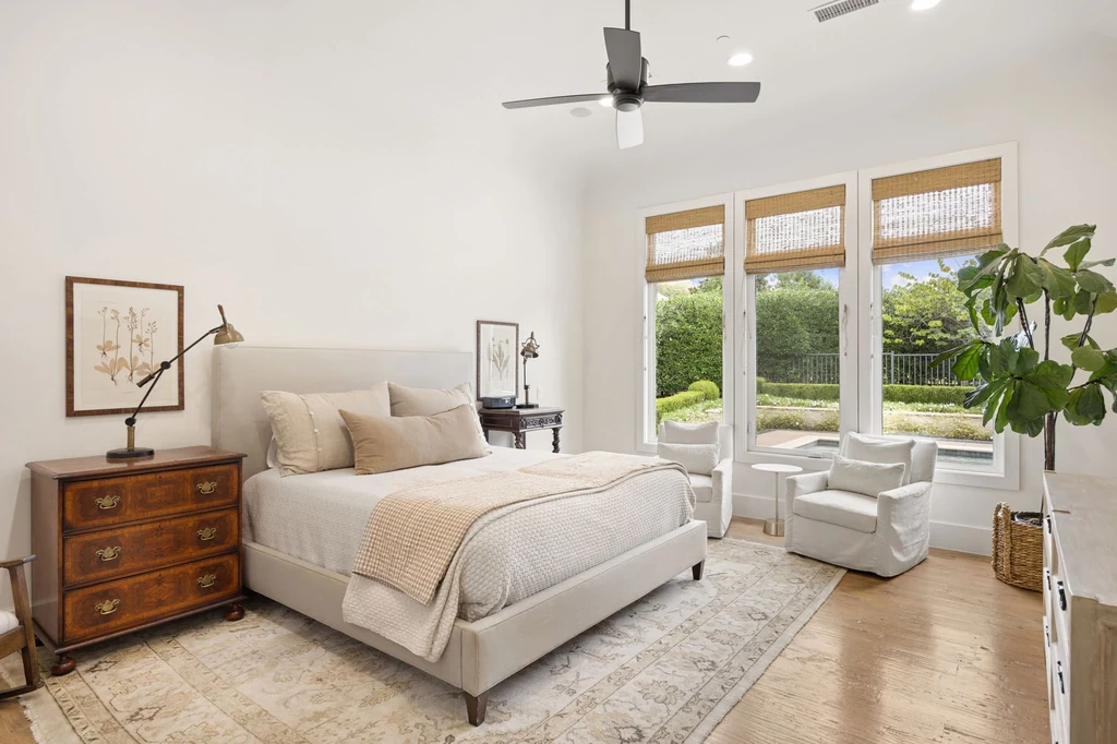 1255 Bolton Ct – Primary Bedroom 1255 Bolton Ct, Southlake: the primary bedroom pairs neutral finishes with windows overlooking greenery.