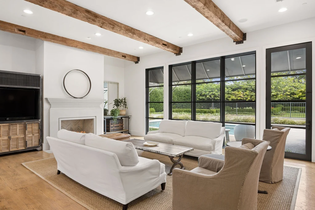 1255 Bolton Ct – Timber Beamed Great Room 1255 Bolton Ct, Southlake: timber beams cross the great room above a pale fireplace and comfortable seating.