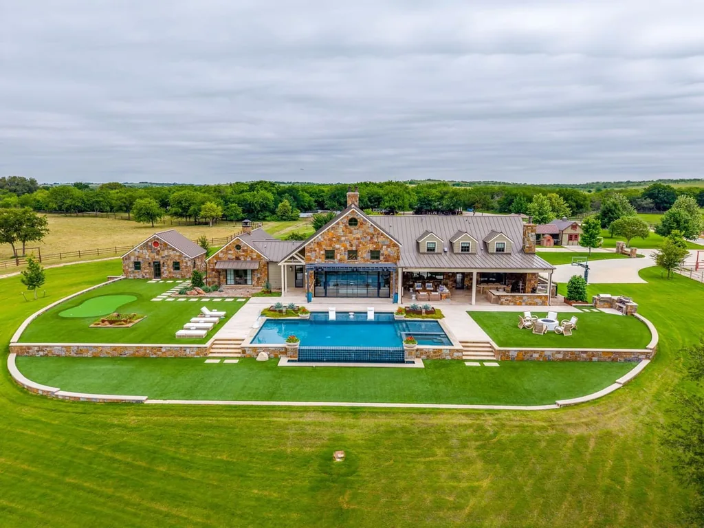 A Texas Estate Built Around Circa-1740 Scottish Timbers Lists for $14,250,000 1 An aerial view places the pool terrace between the stone residence and its open acreage at 13000 Old Weatherford Rd, Aledo