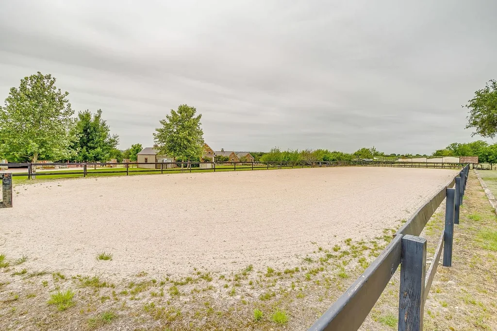 A Texas Estate Built Around Circa-1740 Scottish Timbers Lists for $14,250,000 18 The open riding arena provides a dedicated space for equestrian work at 13000 Old Weatherford Rd, Aledo