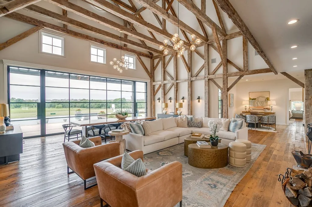 A Texas Estate Built Around Circa-1740 Scottish Timbers Lists for $14,250,000 3 Exposed timber framing rises above the living and dining areas beside steel-framed glazing at 13000 Old Weatherford Rd, Aledo