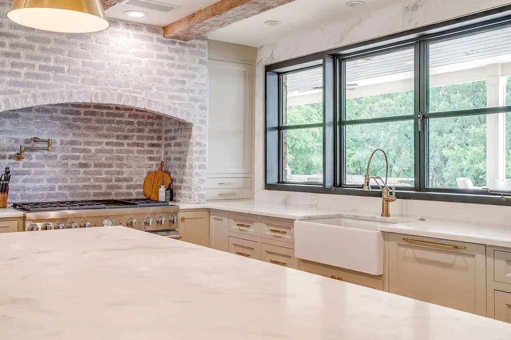 A Texas Estate Built Around Circa-1740 Scottish Timbers Lists for $14,250,000 7 A brick-lined recess frames the kitchen range beneath exposed beams at 13000 Old Weatherford Rd, Aledo