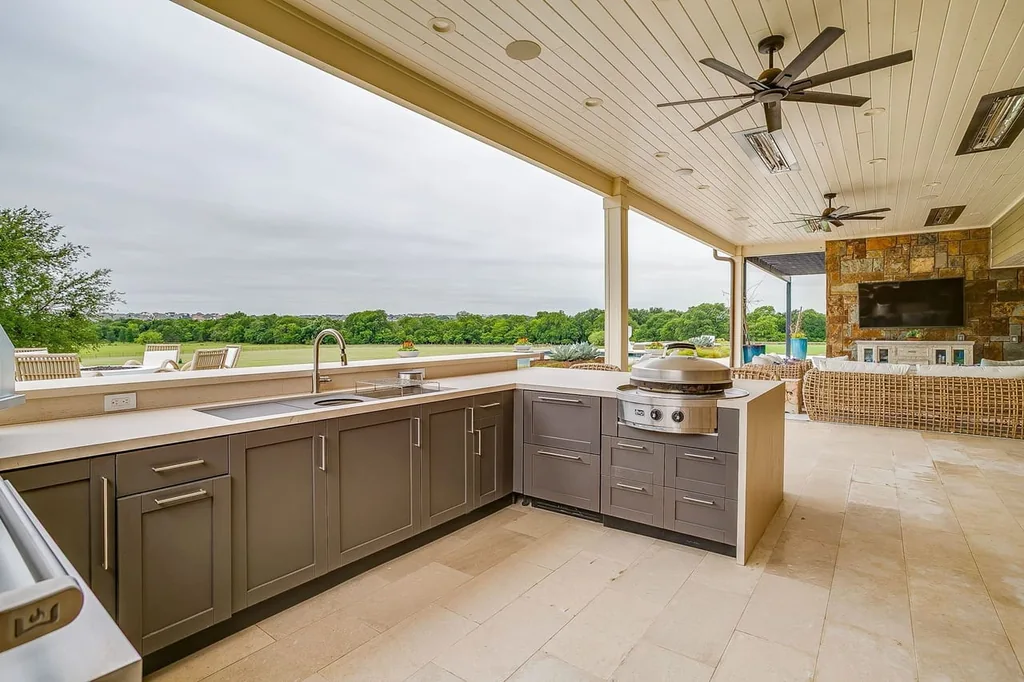 A Texas Estate Built Around Circa-1740 Scottish Timbers Lists for $14,250,000 13 The outdoor kitchen places multiple cooking stations beneath the covered roof at 13000 Old Weatherford Rd, Aledo
