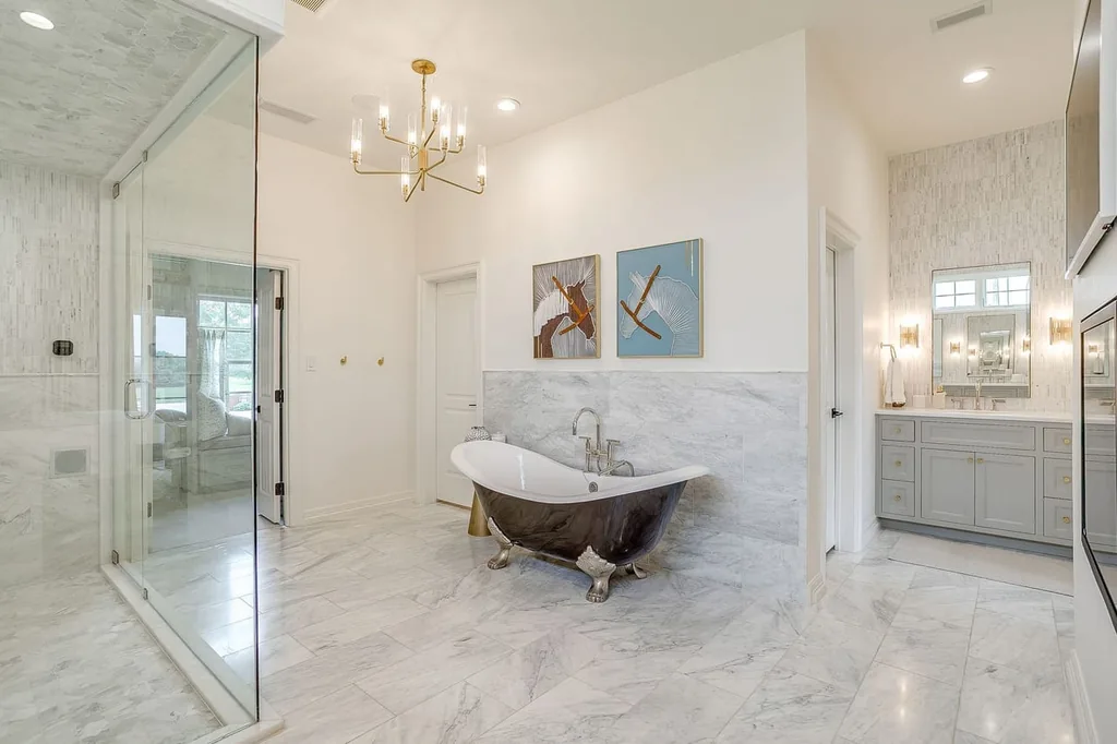 A Texas Estate Built Around Circa-1740 Scottish Timbers Lists for $14,250,000 9 A freestanding tub and glass-enclosed shower define the primary bathroom at 13000 Old Weatherford Rd, Aledo