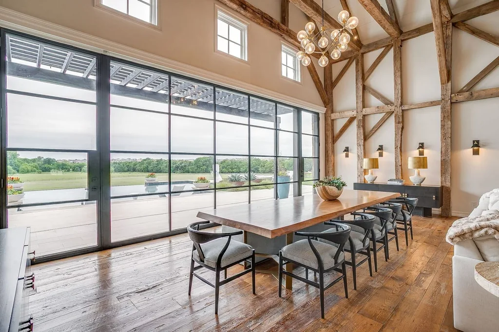 A Texas Estate Built Around Circa-1740 Scottish Timbers Lists for $14,250,000 5 A long dining table sits alongside the glazed wall overlooking the terrace at 13000 Old Weatherford Rd, Aledo