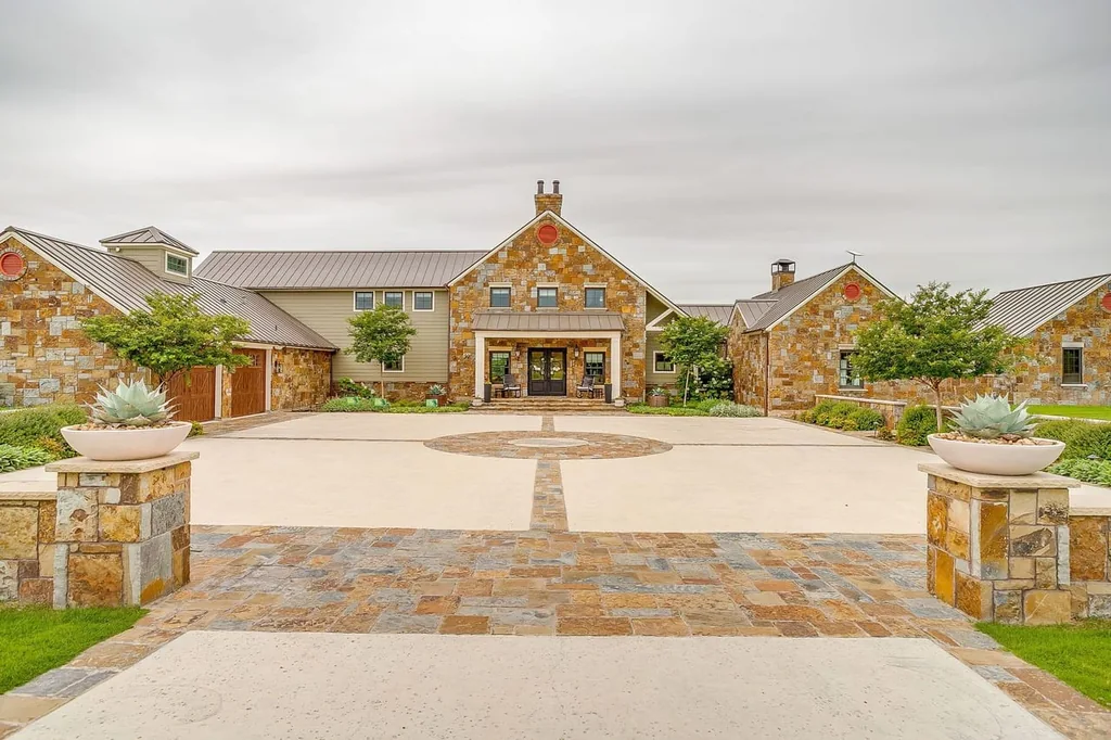 A Texas Estate Built Around Circa-1740 Scottish Timbers Lists for $14,250,000 2 A stone-framed arrival court leads to the gabled entrance at 13000 Old Weatherford Rd, Aledo