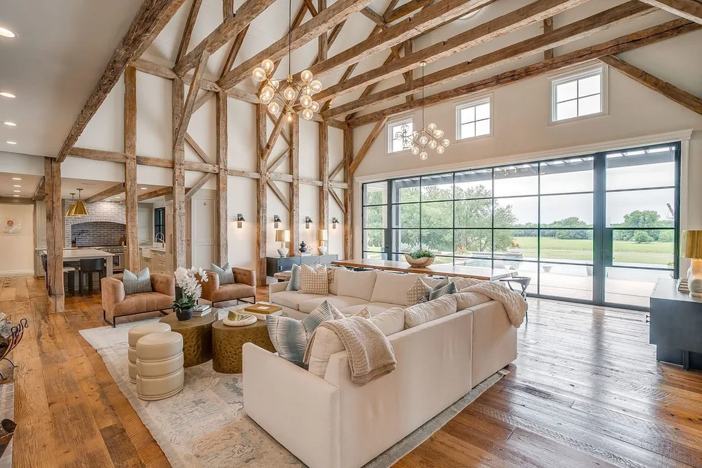 A Texas Estate Built Around Circa-1740 Scottish Timbers Lists for $14,250,000 4 The vaulted great room combines reclaimed wood floors, pale seating and a fireplace at 13000 Old Weatherford Rd, Aledo