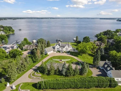 Old Oaks, a 1928 Georgian Revival Estate on Lake Minnetonka, Asks $6,995,000 1 An aerial view places Old Oaks at 1305 Shoreline Dr between its sweeping entrance drive and Lake Minnetonka.