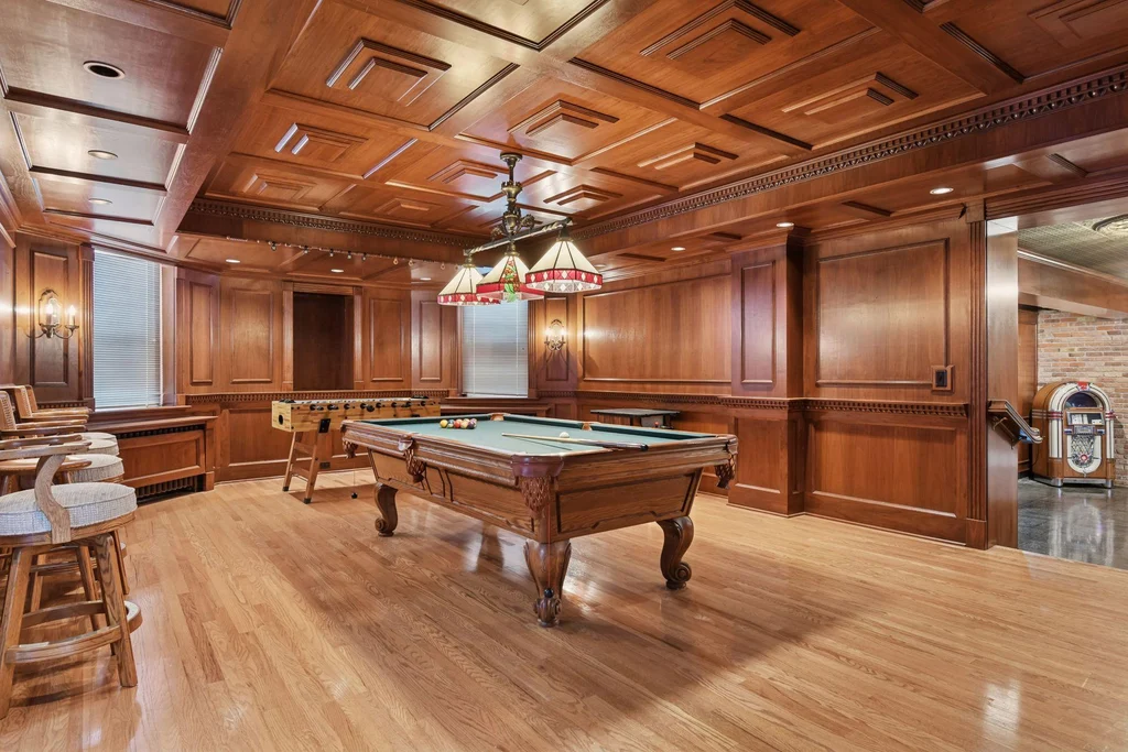 1305 Shoreline Dr — Billiards Room The billiards room continues the lower level’s paneled interior palette at 1305 Shoreline Dr.