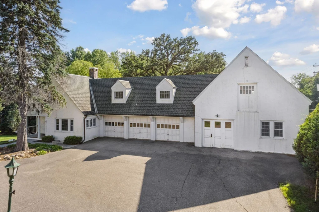 1305 Shoreline Dr — Carriage House Exterior The carriage house adds a separate architectural element to the estate grounds at 1305 Shoreline Dr.