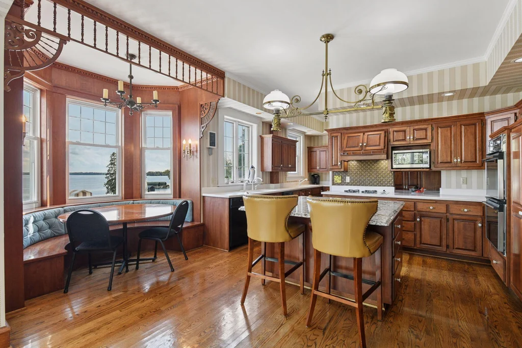 1305 Shoreline Dr — Kitchen Center Island Wood cabinetry and a substantial central island anchor the kitchen at 1305 Shoreline Dr.