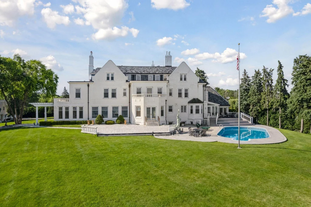 1305 Shoreline Dr — Lakeside Facade Swimming Pool The lakeside elevation opens toward the lawn and an outdoor swimming pool at 1305 Shoreline Dr.