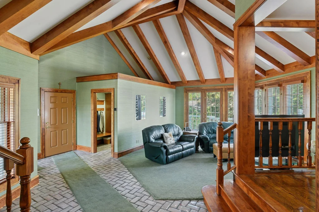 1305 Shoreline Dr — Timbered Upper Landing Exposed timber framing gives the upper landing a different architectural character at 1305 Shoreline Dr.