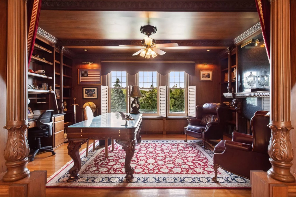 1305 Shoreline Dr — Wood Paneled Library A richly paneled library combines built-in shelves with views of the grounds at 1305 Shoreline Dr.