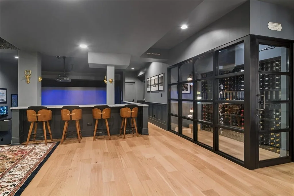 Inverness Estate With a Speakeasy-Style Lounge and Indoor Golf Simulator Lists for $2,750,000 11 Glass-enclosed wine storage beside the lower-level lounge in Inverness, Illinois