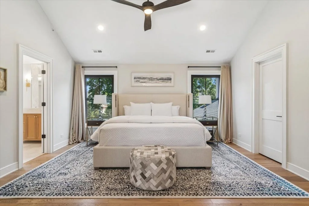 Inverness Estate With a Speakeasy-Style Lounge and Indoor Golf Simulator Lists for $2,750,000 12 Primary bedroom with a vaulted ceiling and black-framed windows in Inverness, Illinois