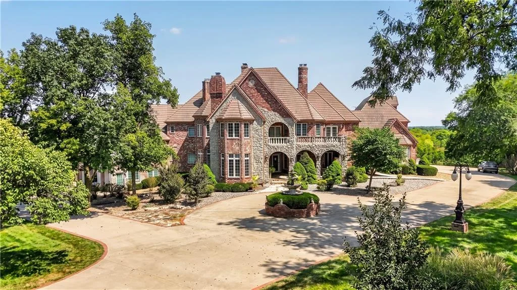 Leawood Estate Bordered by Ironwoods Park on Two Sides Asks $6,500,000 2 A broad motor court opens toward the brick facade and its steeply pitched roofline at 14707 Mission Rd, Leawood