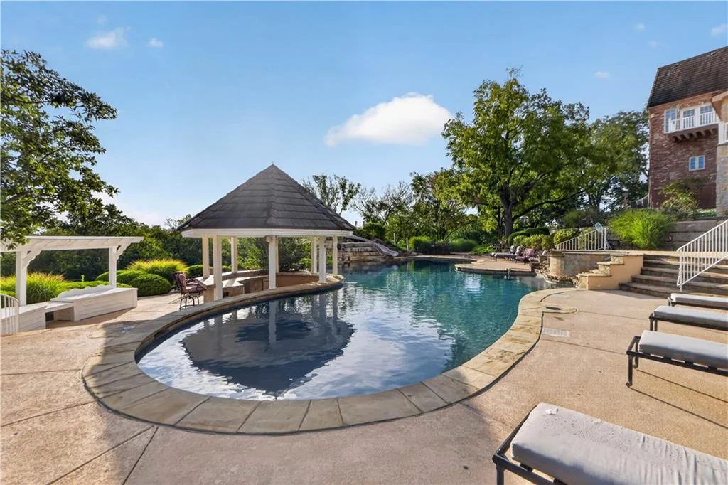 Leawood Estate Bordered by Ironwoods Park on Two Sides Asks $6,500,000 10 A roofed pavilion anchors one end of the pool terrace at 14707 Mission Rd, Leawood