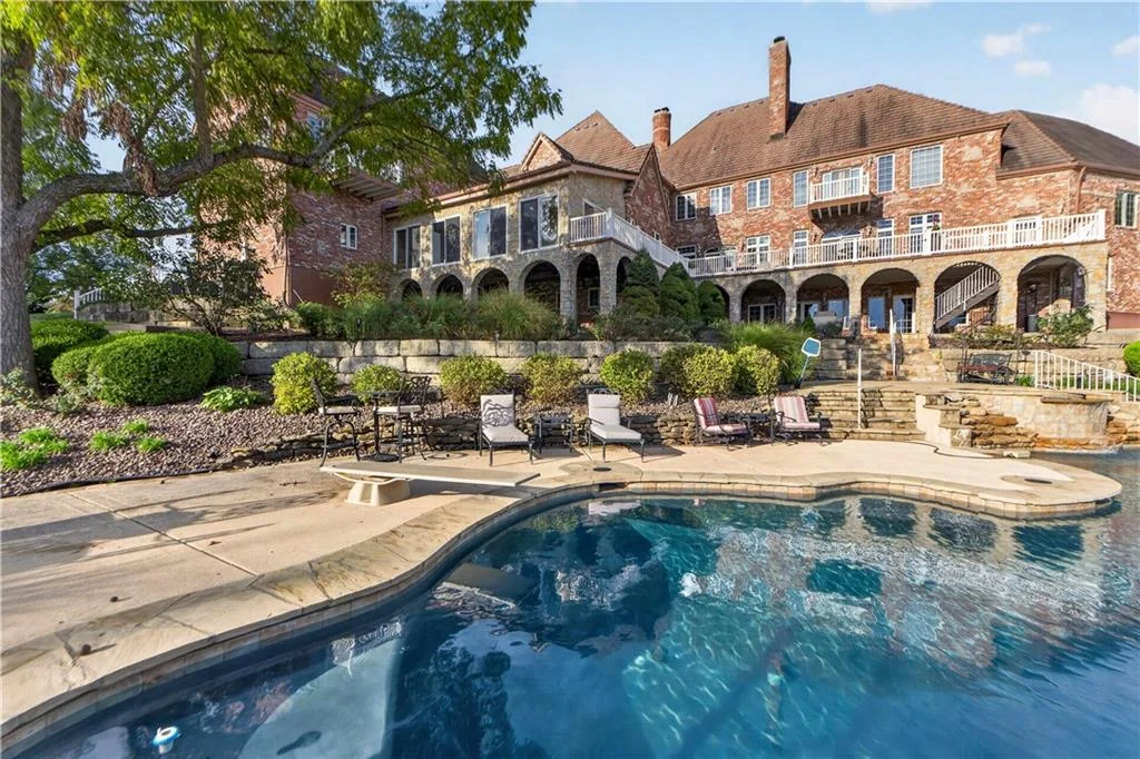 Leawood Estate Bordered by Ironwoods Park on Two Sides Asks $6,500,000 11 The rear facade rises above layered planting and the pool at 14707 Mission Rd, Leawood
