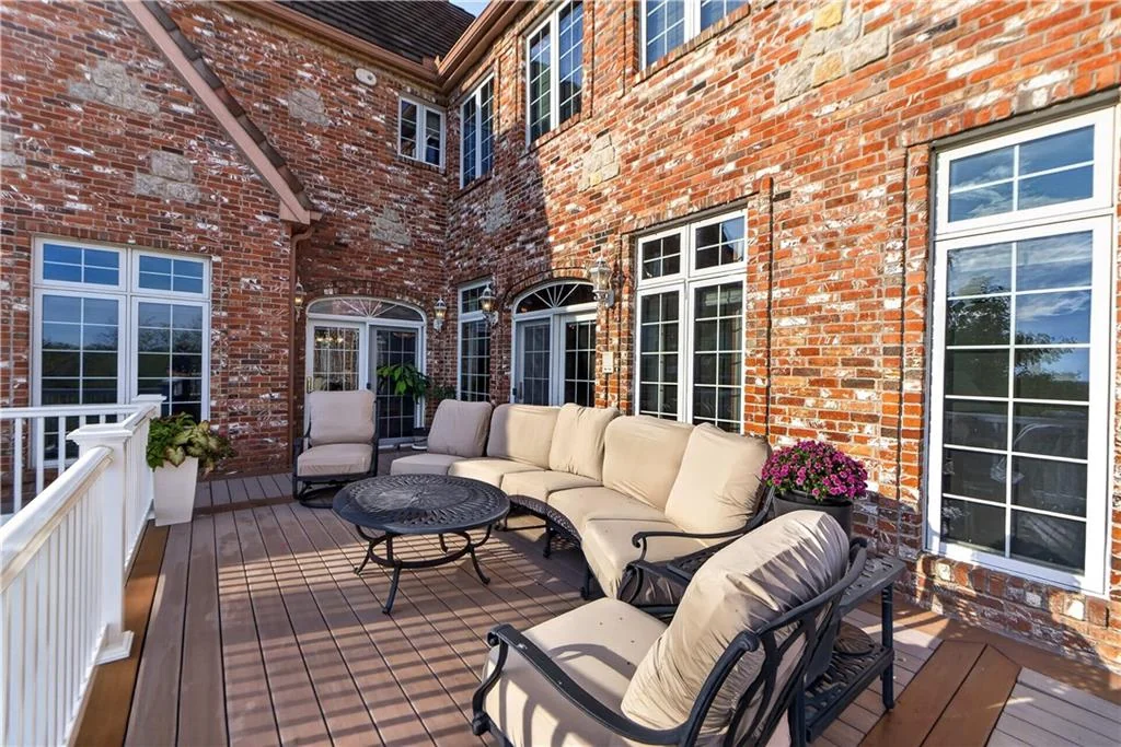 Leawood Estate Bordered by Ironwoods Park on Two Sides Asks $6,500,000 14 A sheltered corner of the deck accommodates outdoor seating at 14707 Mission Rd, Leawood