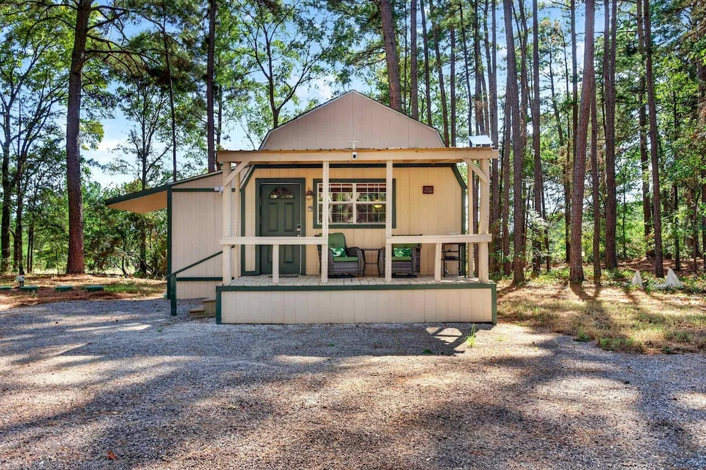16104 County Road 294 – Screened Front Cabin 16104 County Road 294, Arp: a third cabin presents a screened front porch to the surrounding woodland.