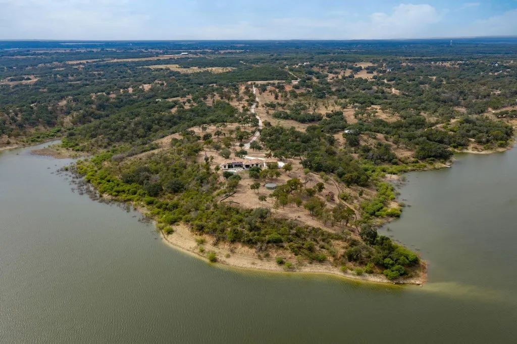 Santa Barbara-Style Lake Travis Estate With 2,300 Feet of Waterfront and Subdivision Potential Lists for $12,000,000 17 2031 County Road 410 Spicewood TX 7866930