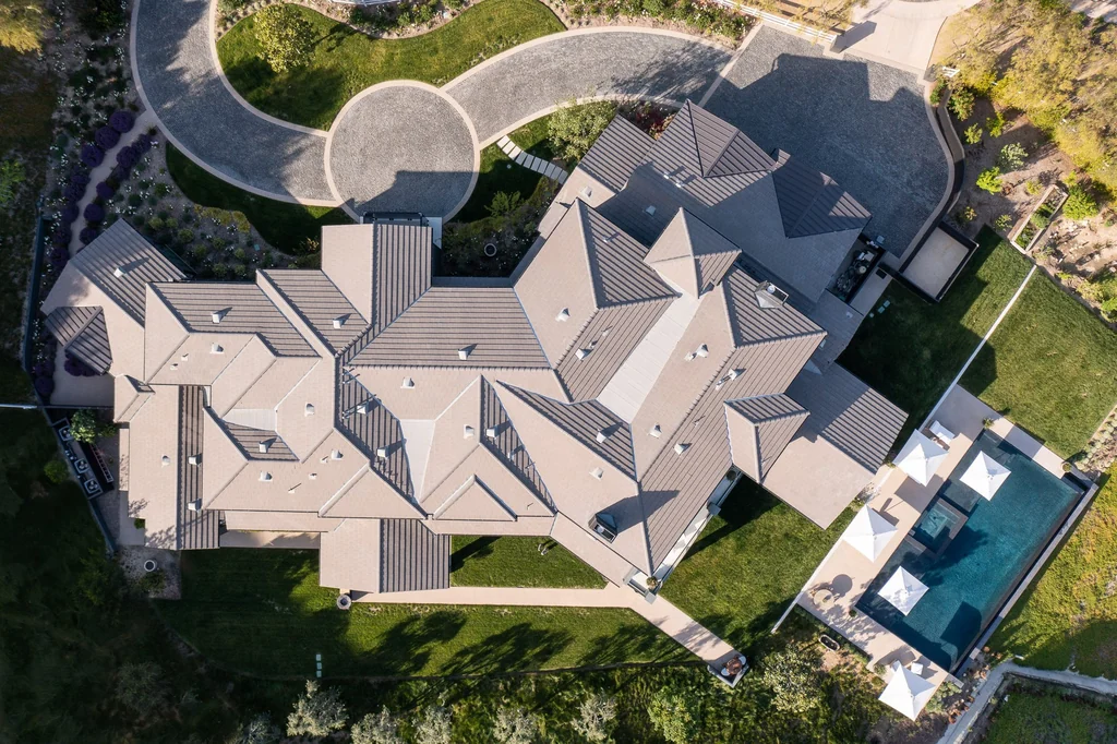 25211 Jim Bridger Rd – Aerial Estate 25211 Jim Bridger Rd, Hidden Hills: an overhead view reveals the residence and curved arrival drive.