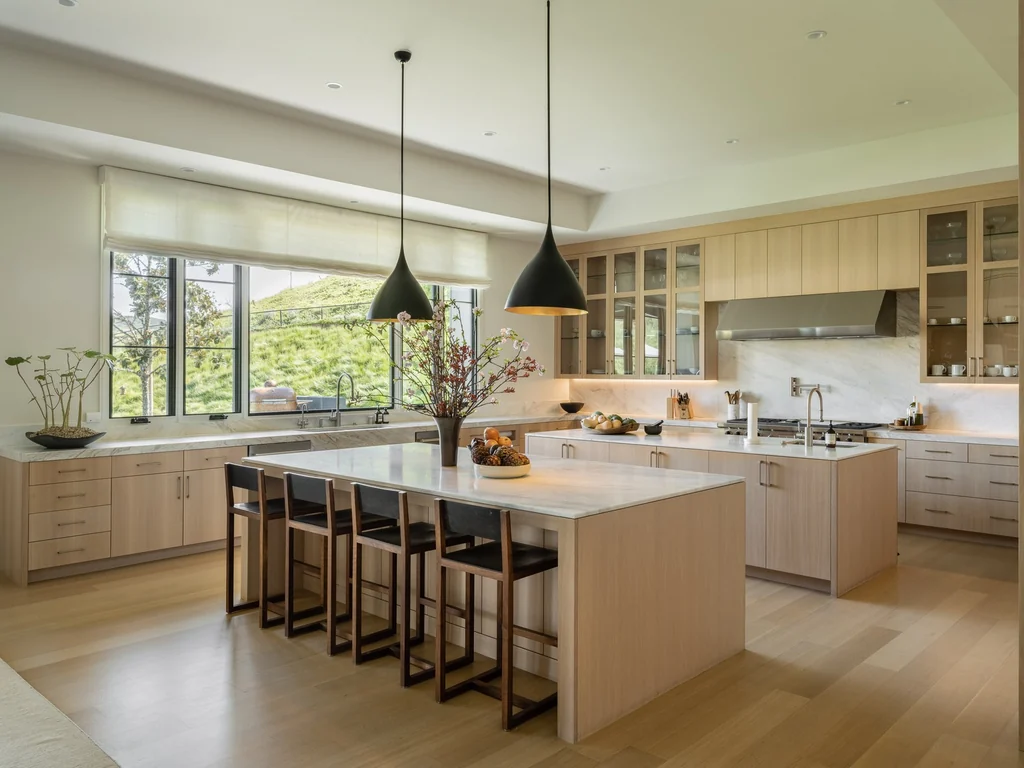 25211 Jim Bridger Rd – Dual Island Kitchen 25211 Jim Bridger Rd, Hidden Hills: two stone islands anchor the light-filled kitchen.