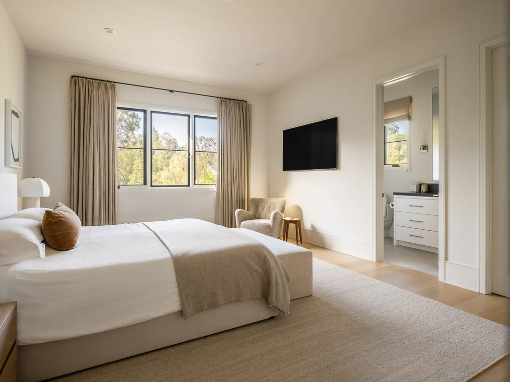 25211 Jim Bridger Rd – Guest Bedroom 25211 Jim Bridger Rd, Hidden Hills: a guest bedroom continues the home’s calm, neutral palette.