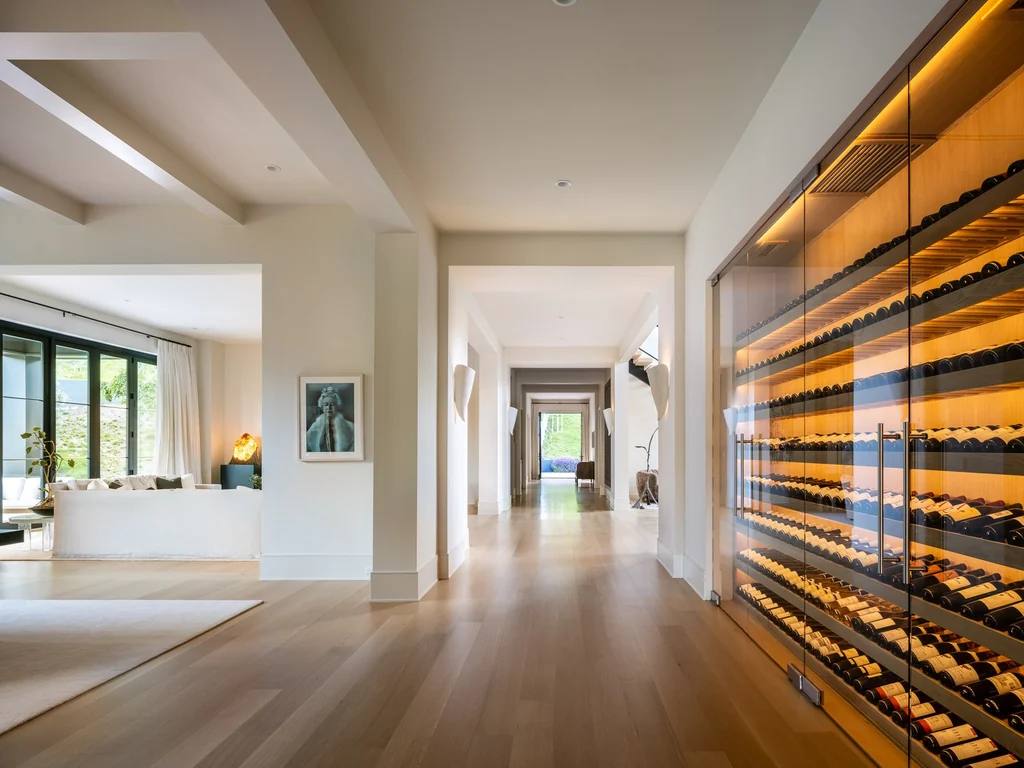 25211 Jim Bridger Rd – Illuminated Wine Wall 25211 Jim Bridger Rd, Hidden Hills: an illuminated wine wall adds a dramatic feature beside the gallery.