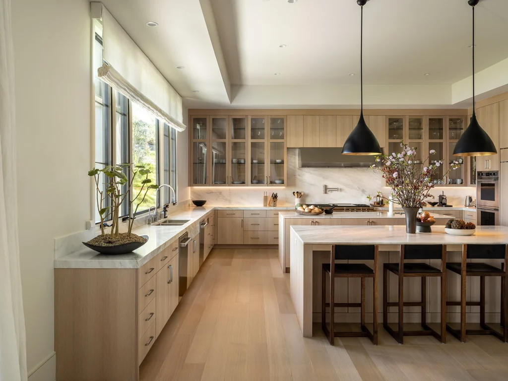 25211 Jim Bridger Rd – Kitchen Cabinetry 25211 Jim Bridger Rd, Hidden Hills: white oak cabinetry and pendant lights define the kitchen.