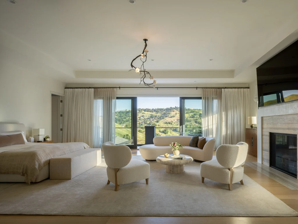 25211 Jim Bridger Rd – Primary Suite Sitting Room 25211 Jim Bridger Rd, Hidden Hills: the primary suite includes a spacious sitting area and fireplace.