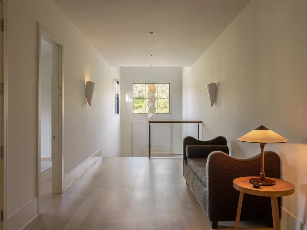 25211 Jim Bridger Rd – Upper Gallery 25211 Jim Bridger Rd, Hidden Hills: natural light brightens the upper gallery and seating niche.
