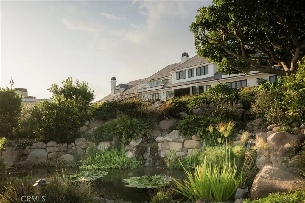 3201 Campanil Dr – Koi Pond Gardens 3201 Campanil Dr, Santa Barbara: a koi pond and rock-lined planting beds sit below the main residence.