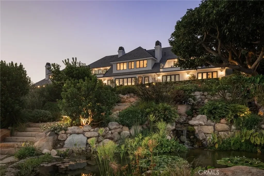 3201 Campanil Dr – Landscaped Estate Twilight 3201 Campanil Dr, Santa Barbara: terraced planting and stonework frame the residence at twilight.