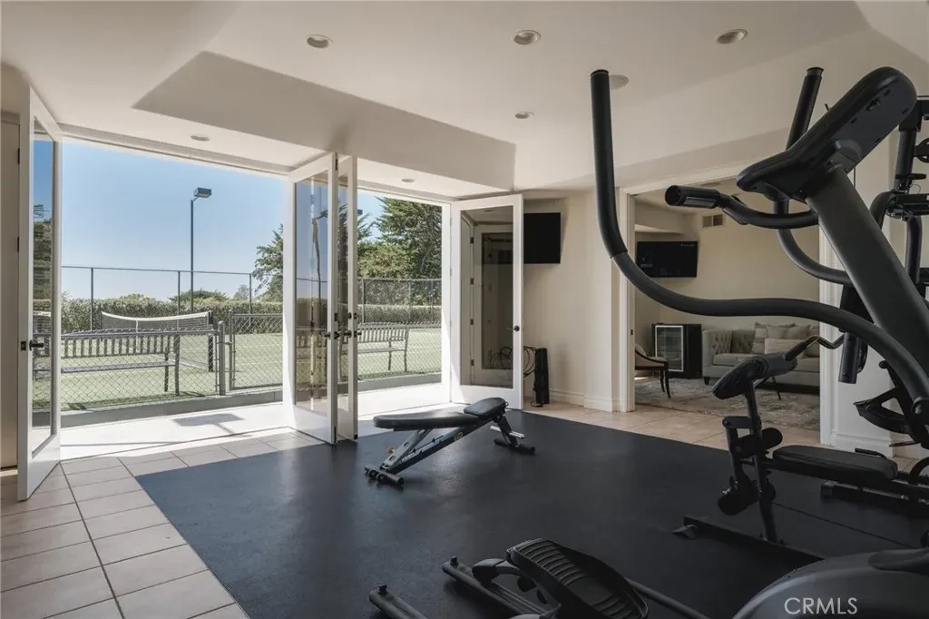 3201 Campanil Dr – Pavilion Fitness Room 3201 Campanil Dr, Santa Barbara: the fitness room opens toward the court through large glass doors.