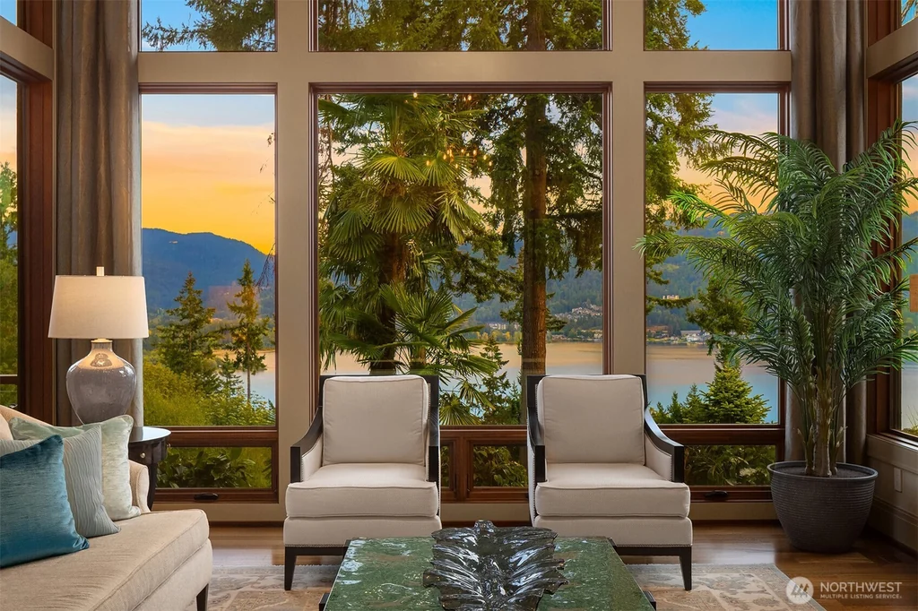 Pocket Doors Open to a Lake-View Pavilion at This Sammamish Estate Asking $6,880,000 5 Seating beside floor-to-ceiling windows facing Lake Sammamish