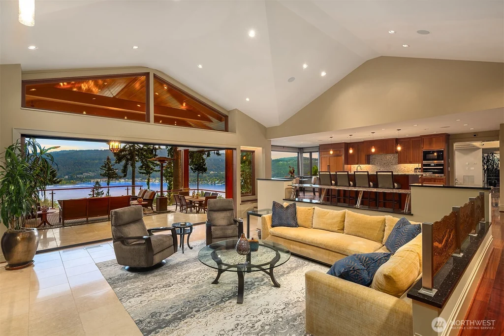 Pocket Doors Open to a Lake-View Pavilion at This Sammamish Estate Asking $6,880,000 8 Family room and kitchen opening toward a covered outdoor pavilion