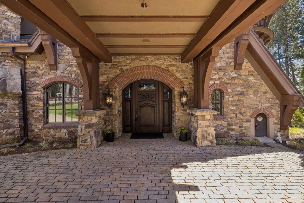 Wayzata Bay Estate With an Octagonal Great Room and 216 Feet of Shoreline Asks $16,450,000 3 A covered portico shelters the entrance beside the cobbled drive at 358 Ferndale Rd S, Wayzata
