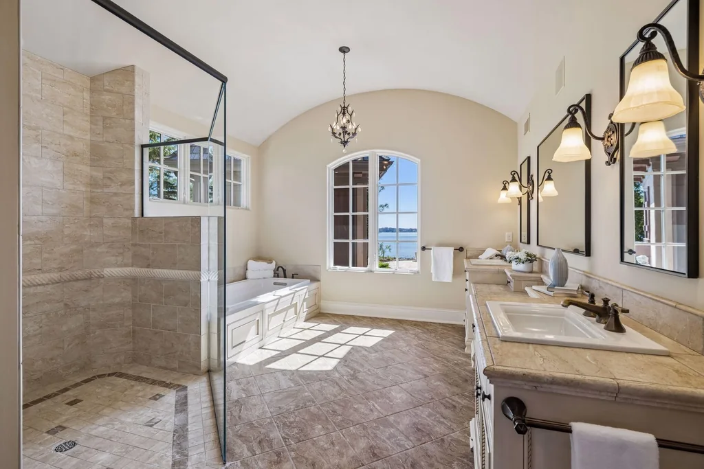 Wayzata Bay Estate With an Octagonal Great Room and 216 Feet of Shoreline Asks $16,450,000 13 The primary bathroom includes a soaking tub, separate shower and double vanity at 358 Ferndale Rd S, Wayzata