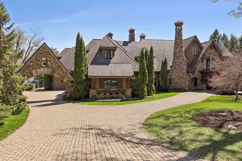 Wayzata Bay Estate With an Octagonal Great Room and 216 Feet of Shoreline Asks $16,450,000 2 Stone walls, a clay-tile roof and tall chimneys define the arrival facade at 358 Ferndale Rd S, Wayzata