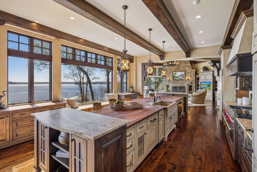 Wayzata Bay Estate With an Octagonal Great Room and 216 Feet of Shoreline Asks $16,450,000 8 The long island follows the kitchen’s lake-facing wall of windows at 358 Ferndale Rd S, Wayzata