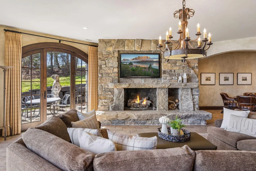 Wayzata Bay Estate With an Octagonal Great Room and 216 Feet of Shoreline Asks $16,450,000 16 A lower-level family room opens toward the lakeside grounds at 358 Ferndale Rd S, Wayzata