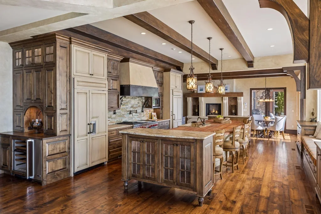Wayzata Bay Estate With an Octagonal Great Room and 216 Feet of Shoreline Asks $16,450,000 7 Walnut cabinetry and a substantial island anchor the main kitchen at 358 Ferndale Rd S, Wayzata