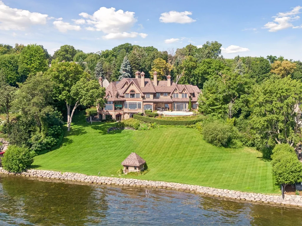 Wayzata Bay Estate With an Octagonal Great Room and 216 Feet of Shoreline Asks $16,450,000 20 An elevated view shows the house above its lawn and shoreline on Wayzata Bay at 358 Ferndale Rd S, Wayzata