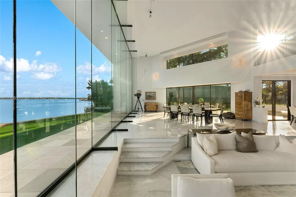 485 W Matheson Dr – Bay View Living Room 485 W Matheson Dr, Key Biscayne: white interiors keep the focus on the blue bay beyond.