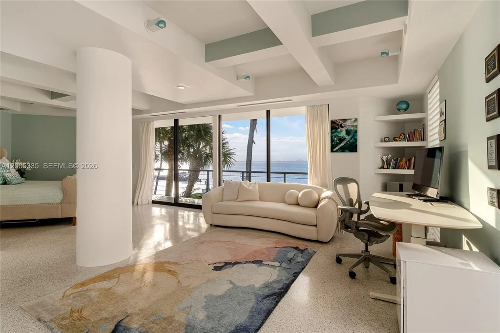 485 W Matheson Dr – Bedroom Water View 485 W Matheson Dr, Key Biscayne: a bedroom opens toward palms and the waterfront.