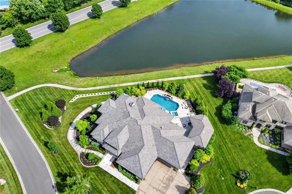 Striking Parkville Estate with a Floating Staircase and Fire-and-Water Pool Asks $3,550,000 31 8085 NW Green Glades Ct Parkville MO 6415212