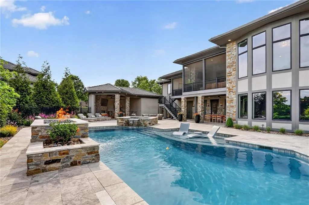 Striking Parkville Estate with a Floating Staircase and Fire-and-Water Pool Asks $3,550,000 26 8085 NW Green Glades Ct Parkville MO 6415232