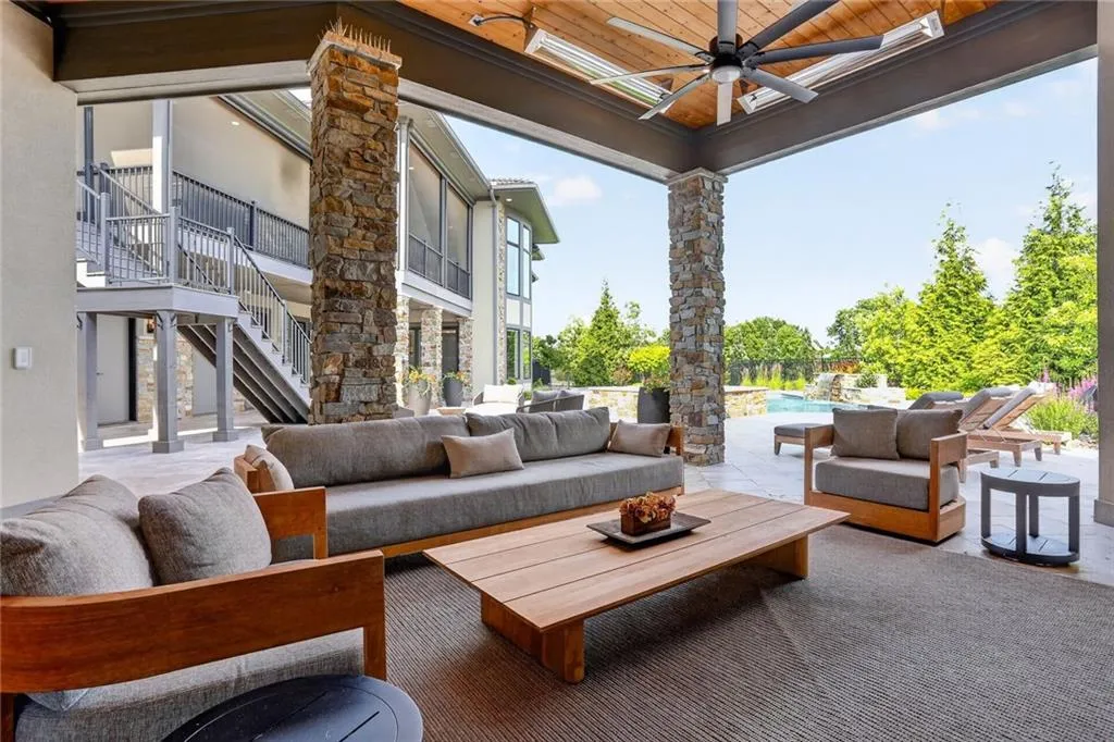 Striking Parkville Estate with a Floating Staircase and Fire-and-Water Pool Asks $3,550,000 25 8085 NW Green Glades Ct Parkville MO 6415235